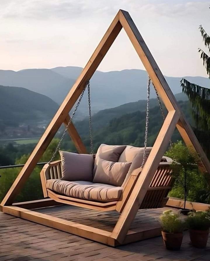 Hand-scribed timber A-frame swing structure for a private garden